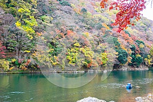 Colorful leaves mountains and Katsura river in Arashiyama, landscape landmark and popular for tourists attractions in Kyoto, Japan