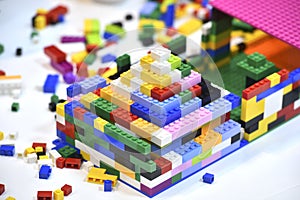 Colorful lego blocks on a white table.