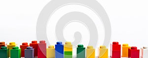 Colorful lego building blocks on a white background. Educational game