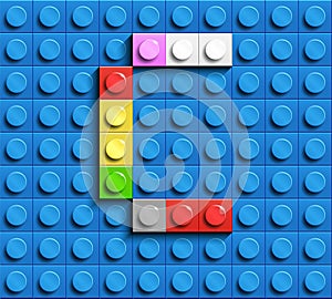 Colorful letter C from building lego bricks on blue lego background. Lego letter M