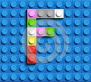 Colorful letter F from building lego bricks on blue lego background. Lego letter M