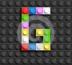 Colorful letter G from building lego bricks on black lego background. Lego letter M