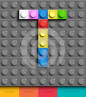 Colorful letter T from building lego bricks on gray lego background. Lego letter M