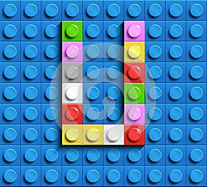 Colorful letter U from building lego bricks on blue lego background. Lego letter M