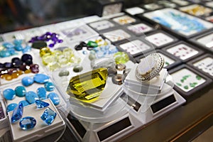 Colorful gems and semi-precious stones in jewelry store photo