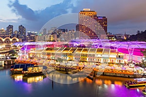 Colorful light building at night in Clarke Quay, Singapore. Clarke Quay, is a historical riverside quay in Singapore.