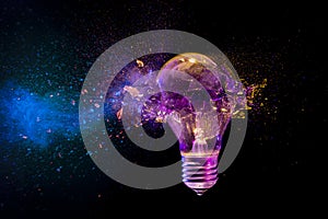 Colorful light bulb exploding