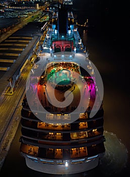 Colorful lights on rear side of the cruise ship in Southampton UK aerial