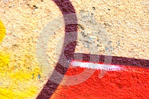 Colorful lines and shapes spray painted on a wall