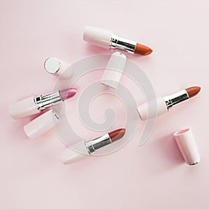 colorful lipsticks white tubes. High quality photo