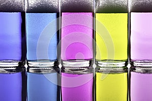 Colorful liquid chemical cleaning agents in glass bottles