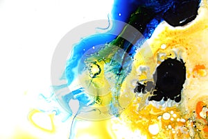 Colorful liquids mixed together to an abstract painting