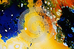 Colorful liquids mixed together to an abstract painting