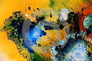 Colorful liquids mixed together to an abstract painting