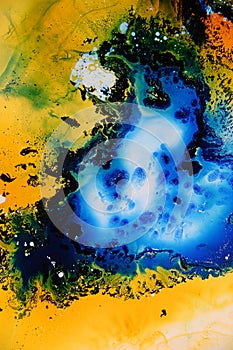 Colorful liquids mixed together to an abstract painting