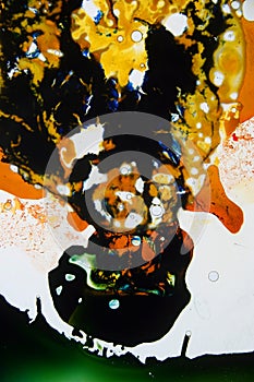 Colorful liquids mixed together to an abstract painting