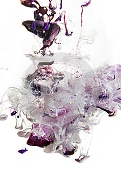 Colorful liquids underwater. Violet. magenta mix with white in pink color composition photo