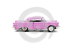 Colorful little mini pink retro vintage plastic sedan car toy isolated on white background mockup with copy space, toys for