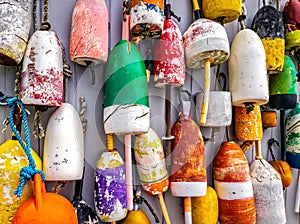 Lobster buoys on wall in Maine