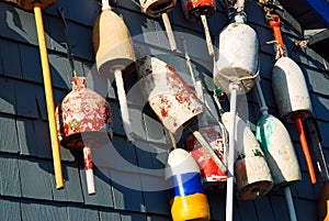 Colorful lobster buoys hang on a wall of a seafood restaurant