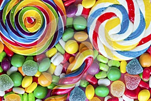 Colorful lollipops and different colored round candy