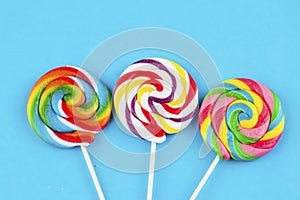 Colorful lollipops and different colored round candy