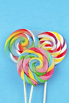 Colorful lollipops and different colored round candy