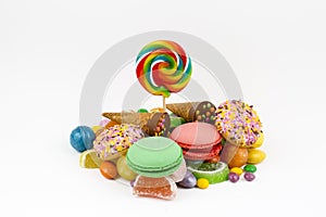 Colorful lollipops and different colored round candy. Top view