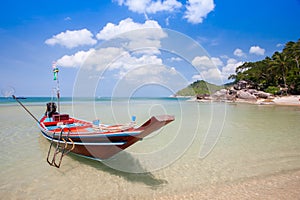 Colorful of longboat at white sand beach