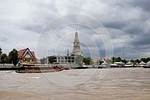 Colorful longtail boat at the Wat Arun temple on Chaopraya river