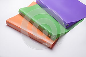 Colorful loose leaf binders used for organization and keeping records