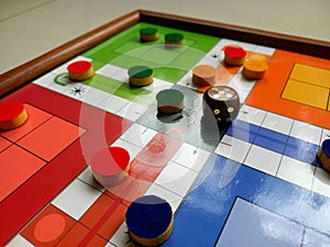 Colorful Ludo game wooden board, indoor game for kids