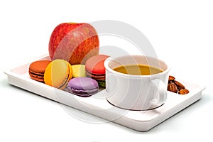 Colorful Macarons, Apple, Almonds and a cup of Coffee