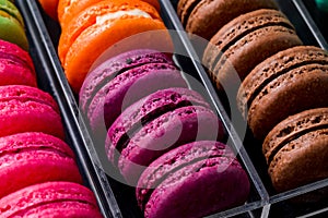 Colorful macarons cookies in the acrylic box
