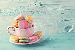 Colorful macarons in a cup