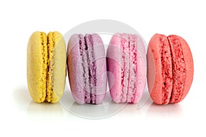 Colorful macarons isolated on white background closeup