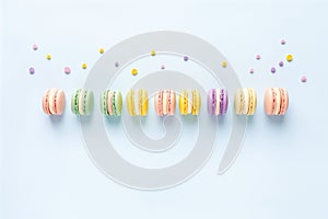 colorful macarons neatly aligned on pastel surface