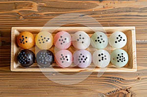 Colorful macarons on wooden tray