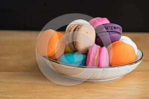 Colorful macaroon in ceramic plate