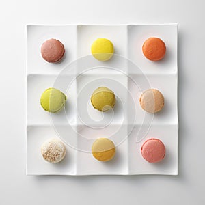 Colorful macaroons on white plate