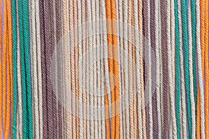 Colorful macrame threads texture closeup