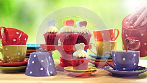 Colorful Mad Hatter style tea party with cupcakes