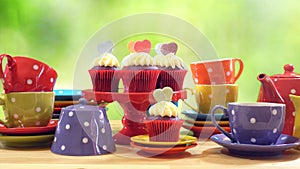 Colorful Mad Hatter style tea party with cupcakes