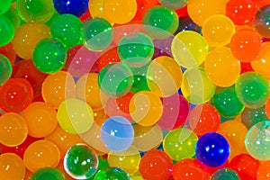 Colorful magic crystal glass jelly balls or bubles texture background. Happiness concept