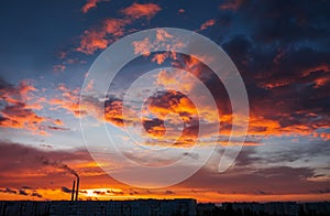 Colorful Magic Sunset. Roofs of city houses during sunrise.