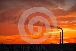 Colorful Magic Sunset. Roofs of city houses during sunrise.