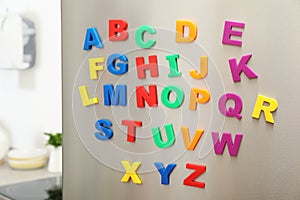 Colorful magnetic letters on refrigerator door