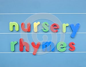 Colorful magnetic letters spelling nursery rhymes.