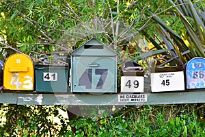 Colorful mailboxes on wooden stand