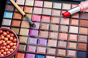 Colorful makeup brushes and makeup eye shadows